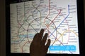 female hand enlarges the electronic map on the information Board in the subway car of the Moscow metro in English