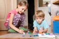 Russia, Moscow, October 2020 - two little happy kids a boy of four year old and a girl of seven year old siblings or friends at ho