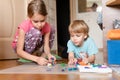 Russia, Moscow, October 2020 - two little happy kids a boy of four year old and a girl of seven year old siblings or friends at ho