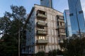 Russia, Moscow. Old empty five-story house on the background of a skyscraper