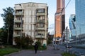 Russia, Moscow. Old empty five-story house. Woman walking the dog