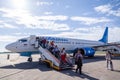 Russia Moscow 2019-06-17 Passengers of Boeing 737 Pobeda Airlines russian company low cost price comes off the plane to airfield Royalty Free Stock Photo