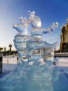 Russia, Moscow region, December 2021. Ice sculptures in Patriot Park. Ice girl rides a deer. sunny winter day