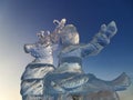 Russia, Moscow region, December 2021. Ice sculptures in Patriot Park. Ice girl rides a deer. sunny winter day