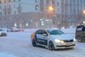 12.02.2021, Russia, Moscow. Snowfall and blizzard on the central streets of the city. Few cars, high snow on the roads,