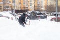 Russia Moscow 13.02.2021 Street cleaners, men clean snow from road, sidewalk with large shovels. City winter weather Royalty Free Stock Photo