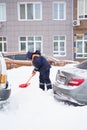 Russia Moscow 13.02.2021 Street cleaners, men clean snow from road, sidewalk with large shovels. City winter weather Royalty Free Stock Photo