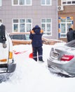 Russia Moscow 13.02.2021 Street cleaners, men clean snow from road, sidewalk with large shovels. City winter weather Royalty Free Stock Photo