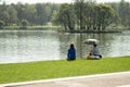 01-05-2018, Russia, Moscow, Tsaritsyno park manor, May holidays in the park, women are resting on the lake on a green lawn. A girl