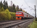 Russia, Mshinskaya, Leningrad region - August 20, 2023: Suburban train follows the railway