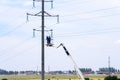 Russia, Naberezhnye Chelny, June 10, 2021: suburban electricity consumption. A team of electricians maintains the overhead power l
