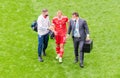Russia national football team doctors escorting midfielder Dmitri Barinov from the pitch following injury in EURO 2020 match