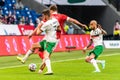 Russia national football team striker Alexander Sobolev against Bulgaria players Andrea Hristov and Momchil Tsvetanov during Royalty Free Stock Photo