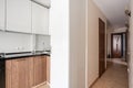 Russia, Nizhny Novgorod - January 10, 2018: Private apartment. Interior design. Small modern kitchen in white and wenge Royalty Free Stock Photo