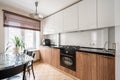 Russia, Nizhny Novgorod - January 10, 2018: Private apartment. Interior design. Small modern kitchen in white and wenge Royalty Free Stock Photo