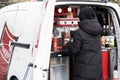 Russia, Novorossiysk, April 11, 2021: mobile coffee shop. Barista at work: prepares a milk drink