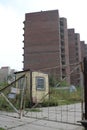 Russia, abandoned construction site unfinished house on a closed site behind the gate fence Royalty Free Stock Photo