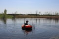 a boy on a rubber inflatable boat swims in the river on the lake