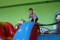 Russia, a cheerful little boy plays in a playground with attractions for a child Royalty Free Stock Photo