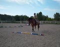 Russia, a child boy riding a horse in the arena athlete in a helmet