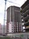 Construction of a high multi-storey building with a crane concrete walls with overlapping floors