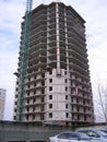 construction of a high multi-storey building with a crane concrete walls with overlapping floors