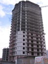 construction of a high multi-storey building with a crane concrete walls with overlapping floors