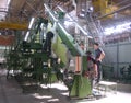 employees specialists at an industrial plant prepare machine parts for aircraft equipment