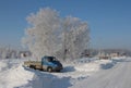 frosty winter in Siberia truck stuck in the snow rural climate
