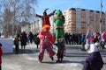 funny clowns dressed up at a holiday for citizens street actors amuse passers - by with children