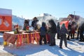 a large crowd of people at the traditional Maslenitsa holiday walk in winter children rejoice