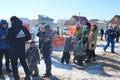 A large crowd of people at the traditional Maslenitsa holiday walk in winter children rejoice