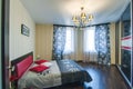 Russia, Novosibirsk - 07 May, 2016: interior room apartment. decorative elements, large beautiful bed in the bedroom, chandelier Royalty Free Stock Photo