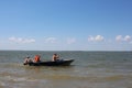 men swim in a motor boat in life jackets on a boat in the summer in the river