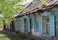 Russia, old broken wooden house abandoned with windows for sale in the village