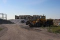 old rusty tractors on an abandoned construction site industrial facility