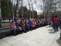 old women pensioners sit on a bench in the park grandmothers talk