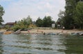 Russia, people relax on the beach swim in the river in the summer swim with boats on the shore