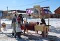 people at the traditional Maslenitsa holiday walk in winter children rejoice tables with treats at