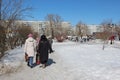 people women walk down the street in winter in the park back