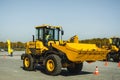 Russia, Novosibirsk - September 19, 2018: Excavator Loader Machine. Side View of Front Hoe Loader. Industrial Vehicle. Heavy Royalty Free Stock Photo