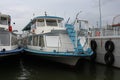 Russia, steamers at the pier boats with stern for tourists walking on the river