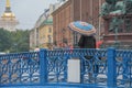 Russia, old St. Petersburg. People in the city, Blue bridge, a lady with a blue umbrella, sights, city landscape