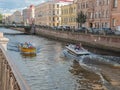 Russia, old St. Petersburg. People in the city, a bright summer day, rivers and canals, boats, old town, sights, city landscape