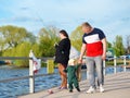 Russia, Pereslavl-Zalessky, May 11, 2023.A girl is fishing with a fishing rod on the embankment of Lake Pleshcheyevo Royalty Free Stock Photo