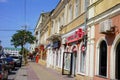 Central street in Makhachkala with shops and pharmacy.