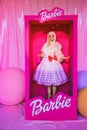 Beautiful barbie girl in white wig and pink dress. The image of a popular doll. Royalty Free Stock Photo