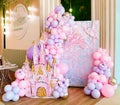 Beautiful pink photo zone with a castle and balloons for a fabulous birthday.