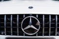 logo and camera parktronic. a white Mercedes-Benz car.