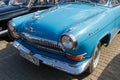 Front part of car GAZ-21 Volga of the bright blue colour. Left view
